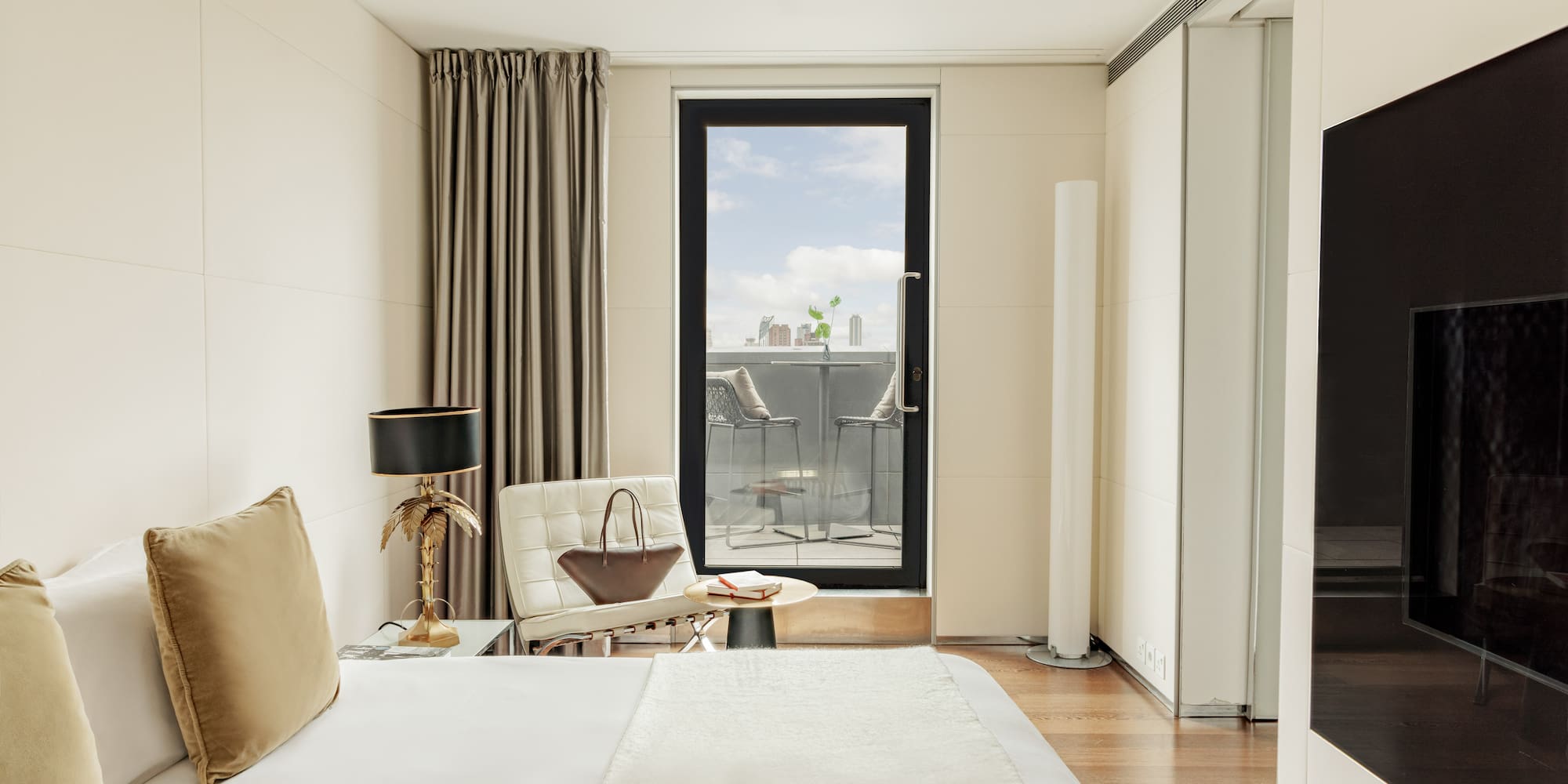 a bedroom with a bed and a chair