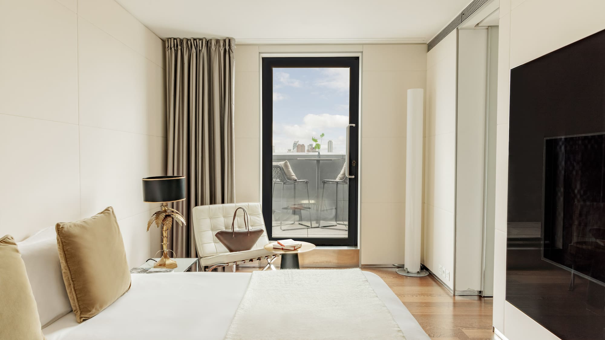 a bedroom with a bed and a chair