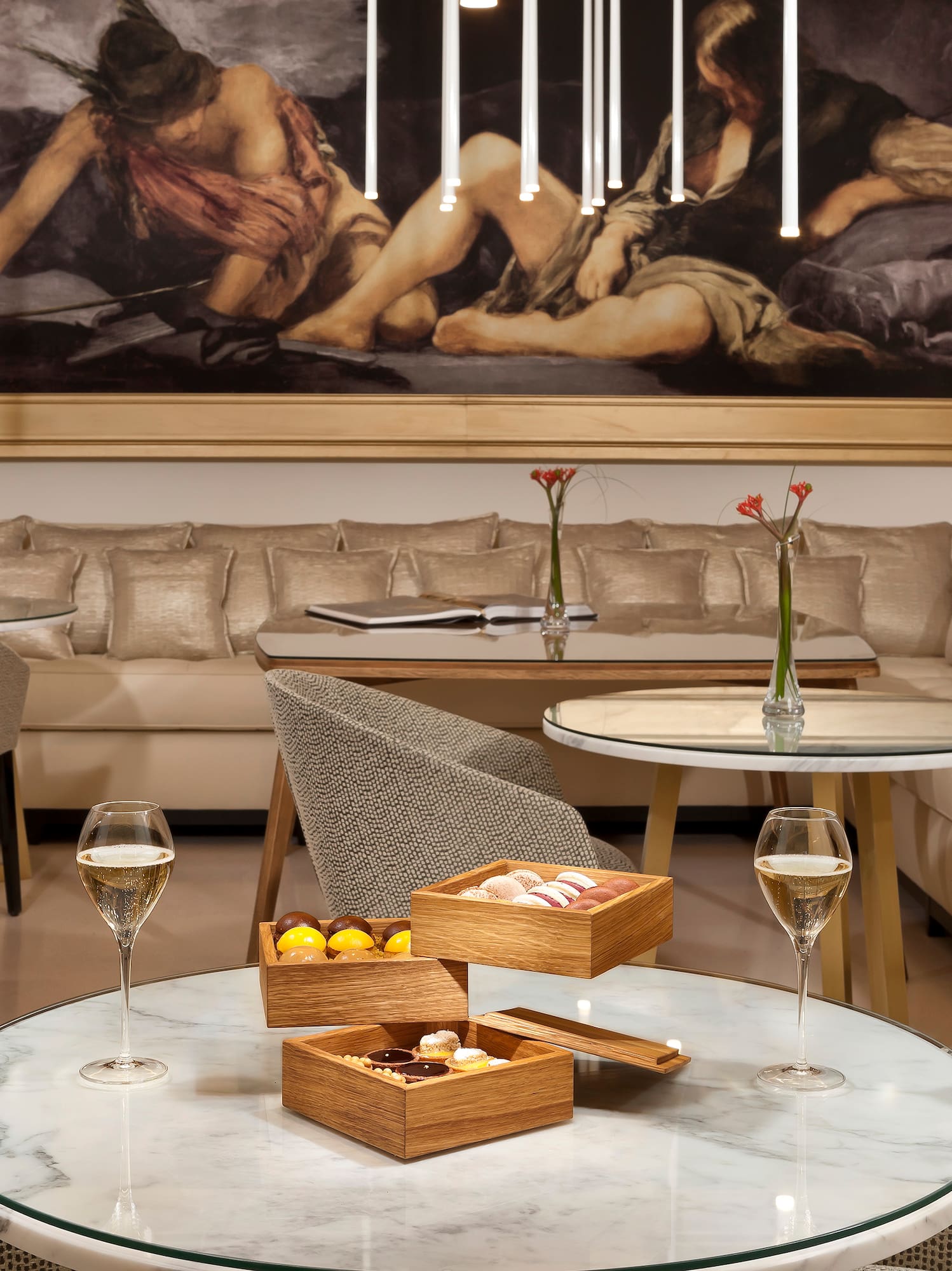 a room with a couch and a painting on the wall