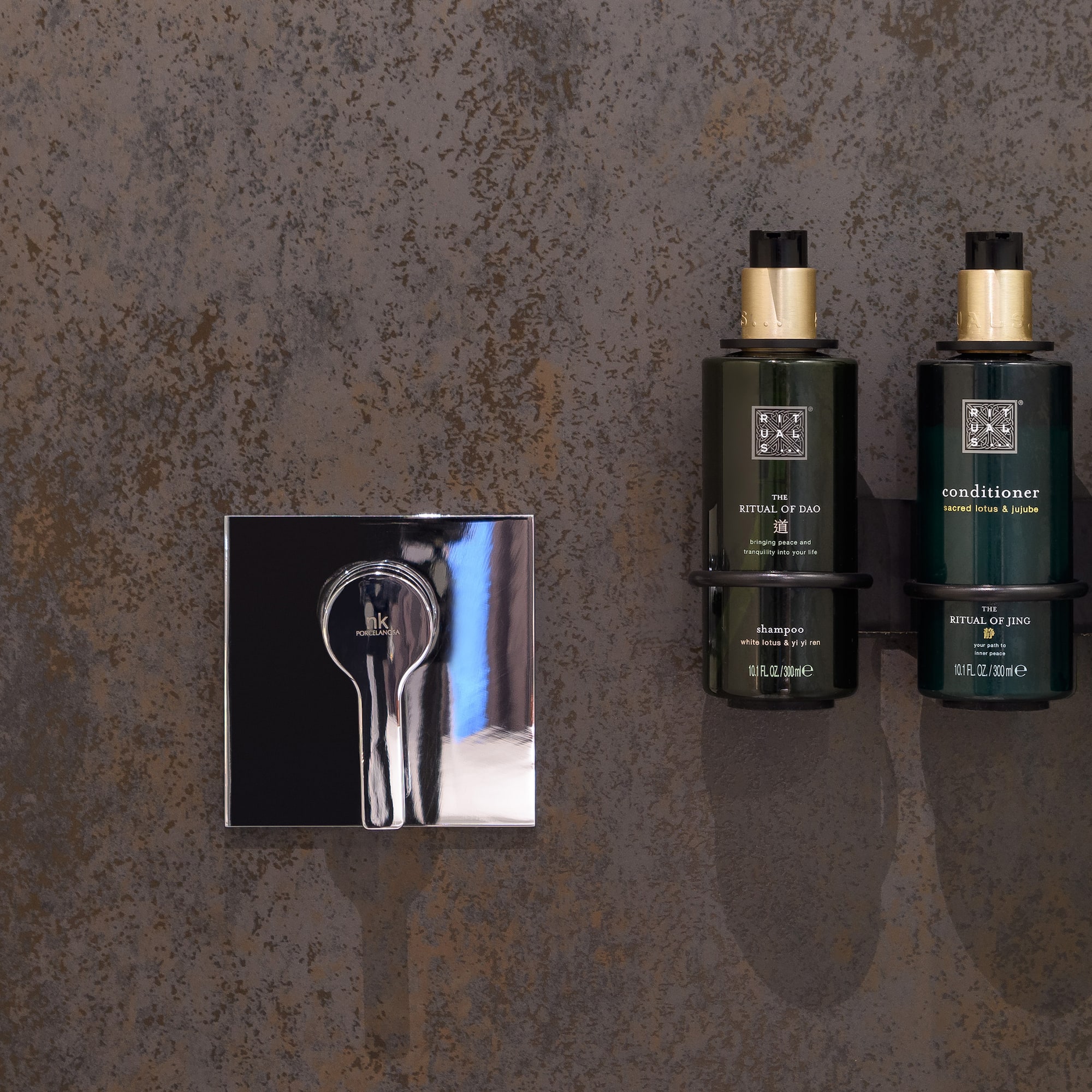 a group of green bottles next to a silver mirror