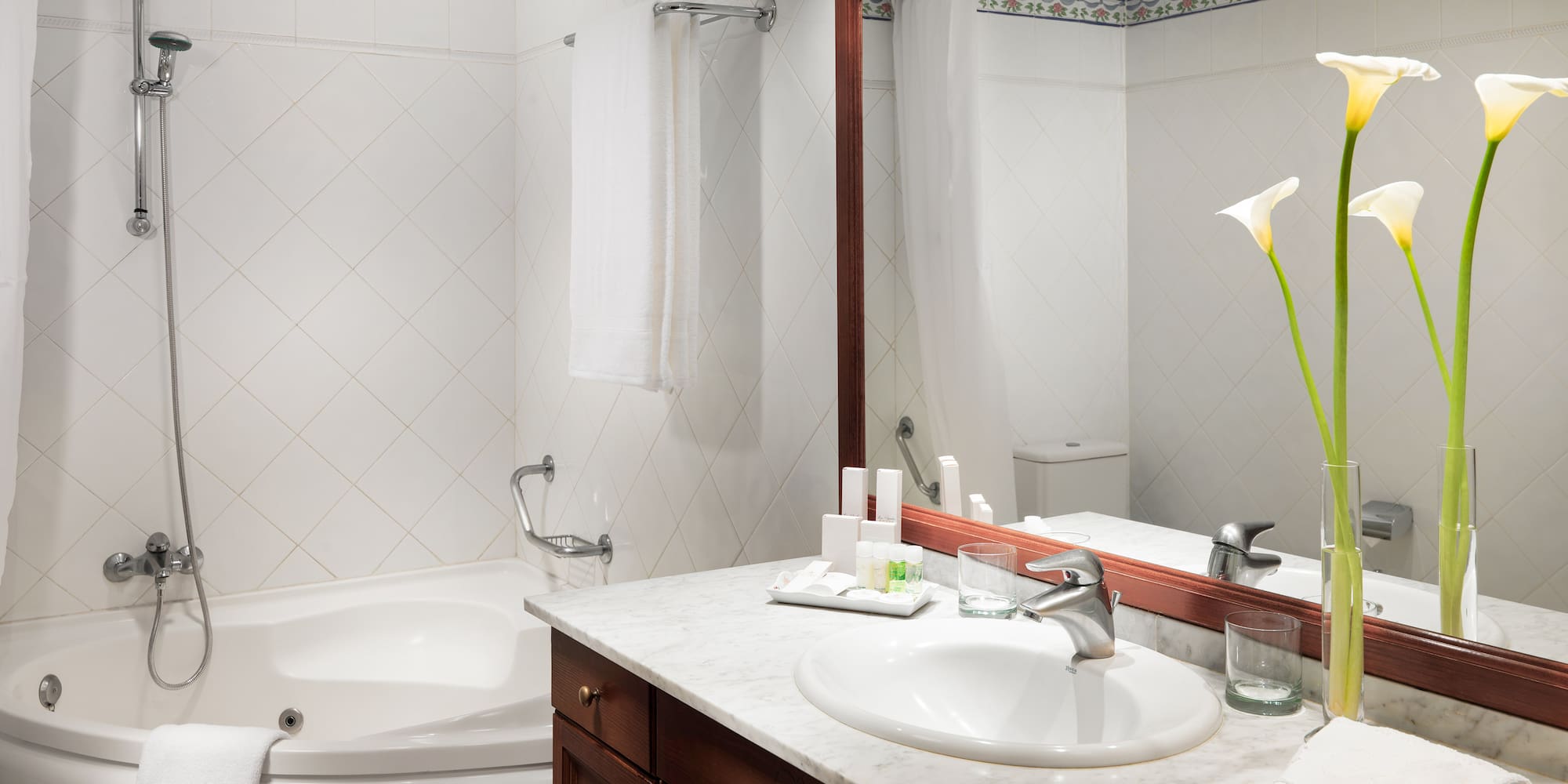 a bathroom with a tub and sink