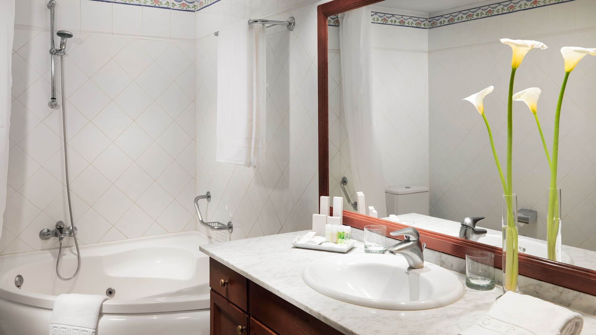 a bathroom with a tub and sink