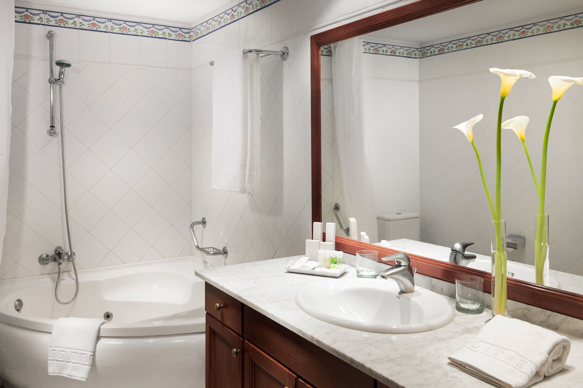 a bathroom with a tub and sink