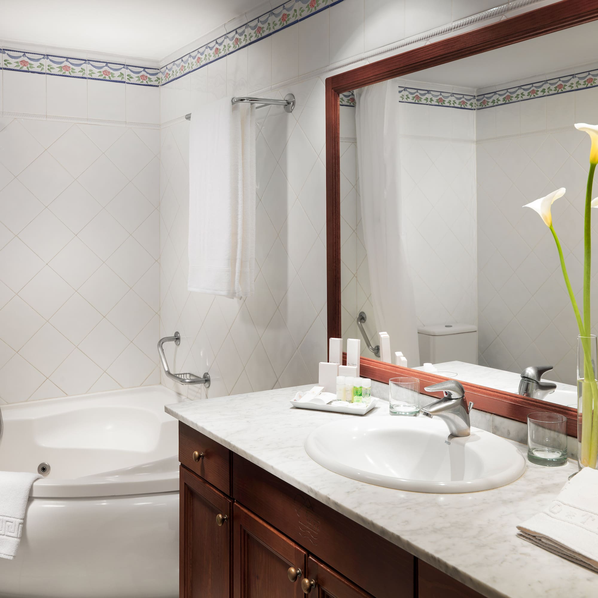 a bathroom with a tub and sink