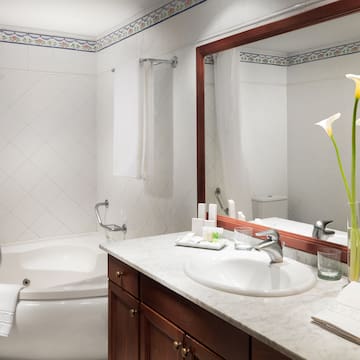 a bathroom with a tub and sink