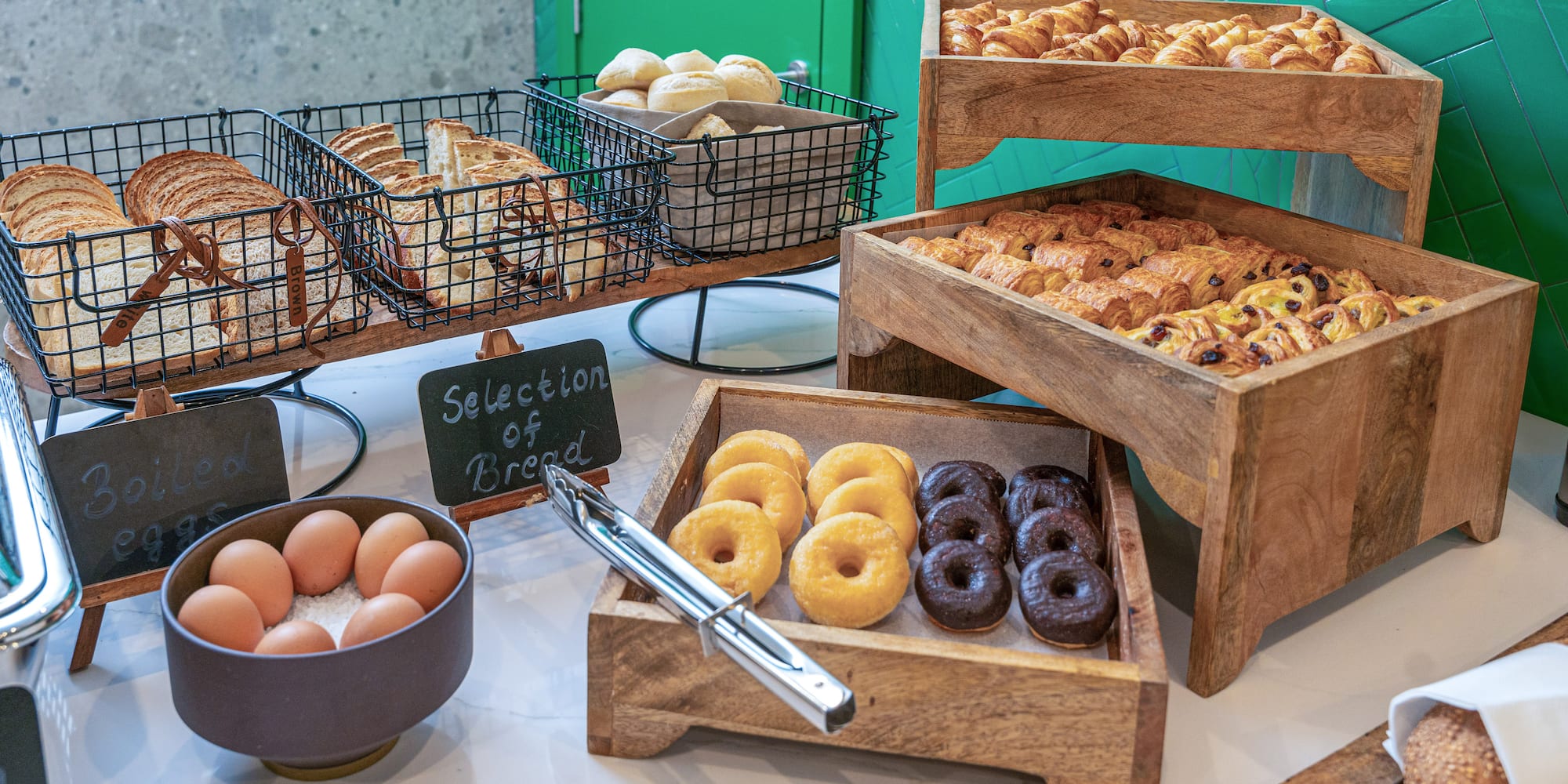 a variety of pastries and eggs on a table