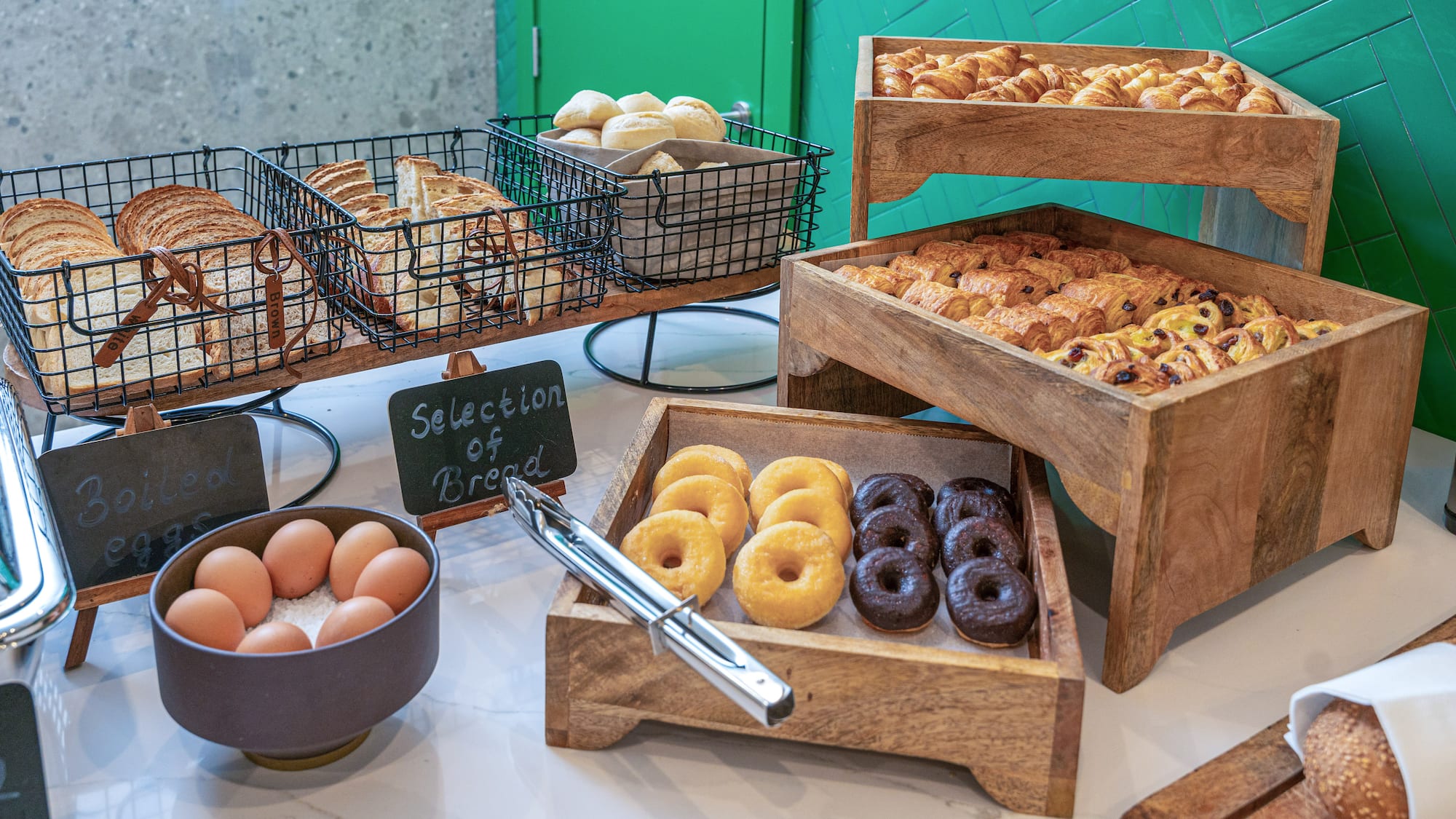a variety of pastries and eggs on a table