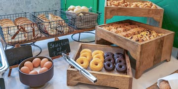 a variety of pastries and eggs on a table