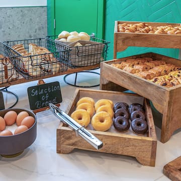 a variety of pastries and eggs on a table