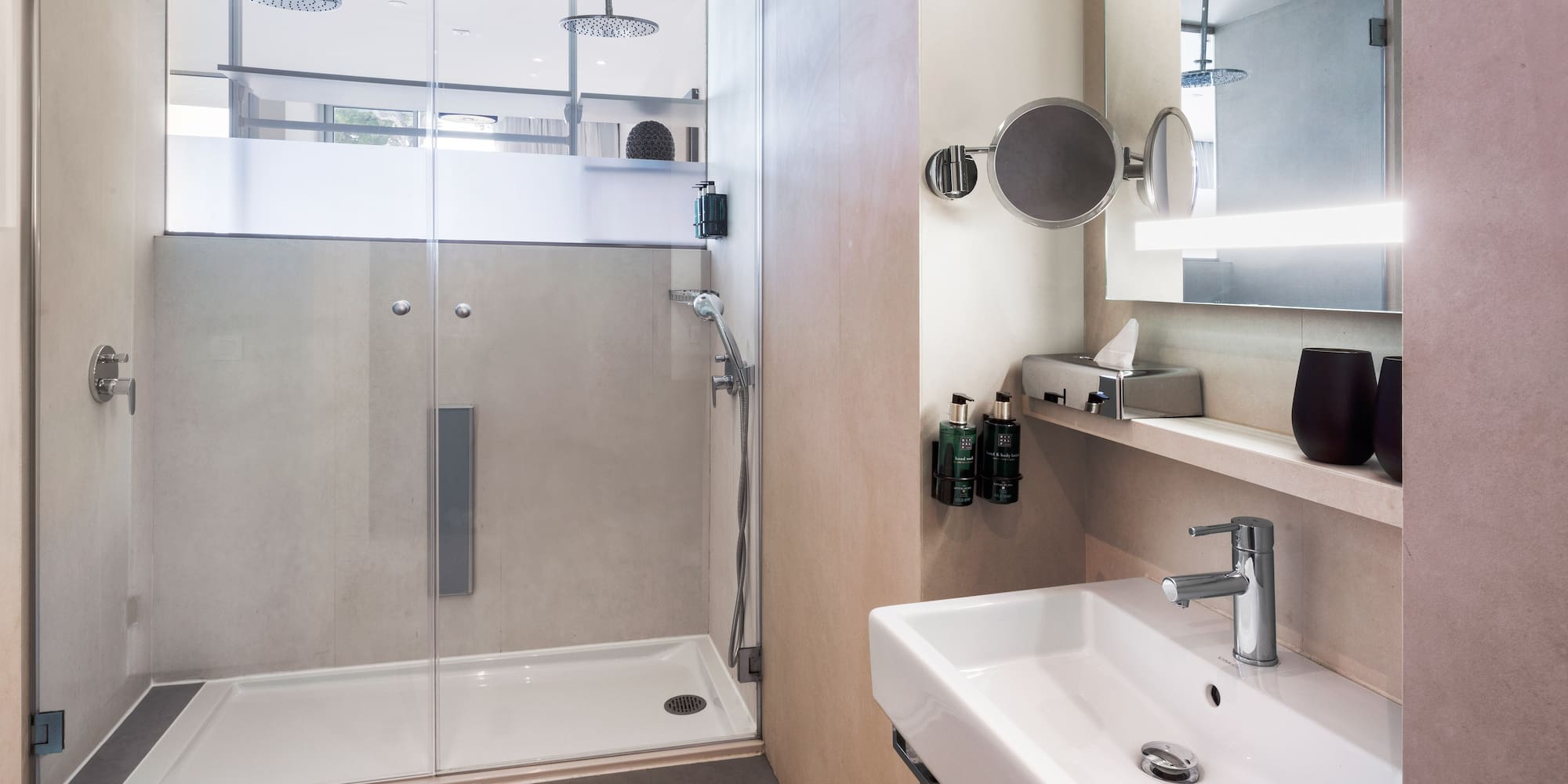 a bathroom with a shower and sink