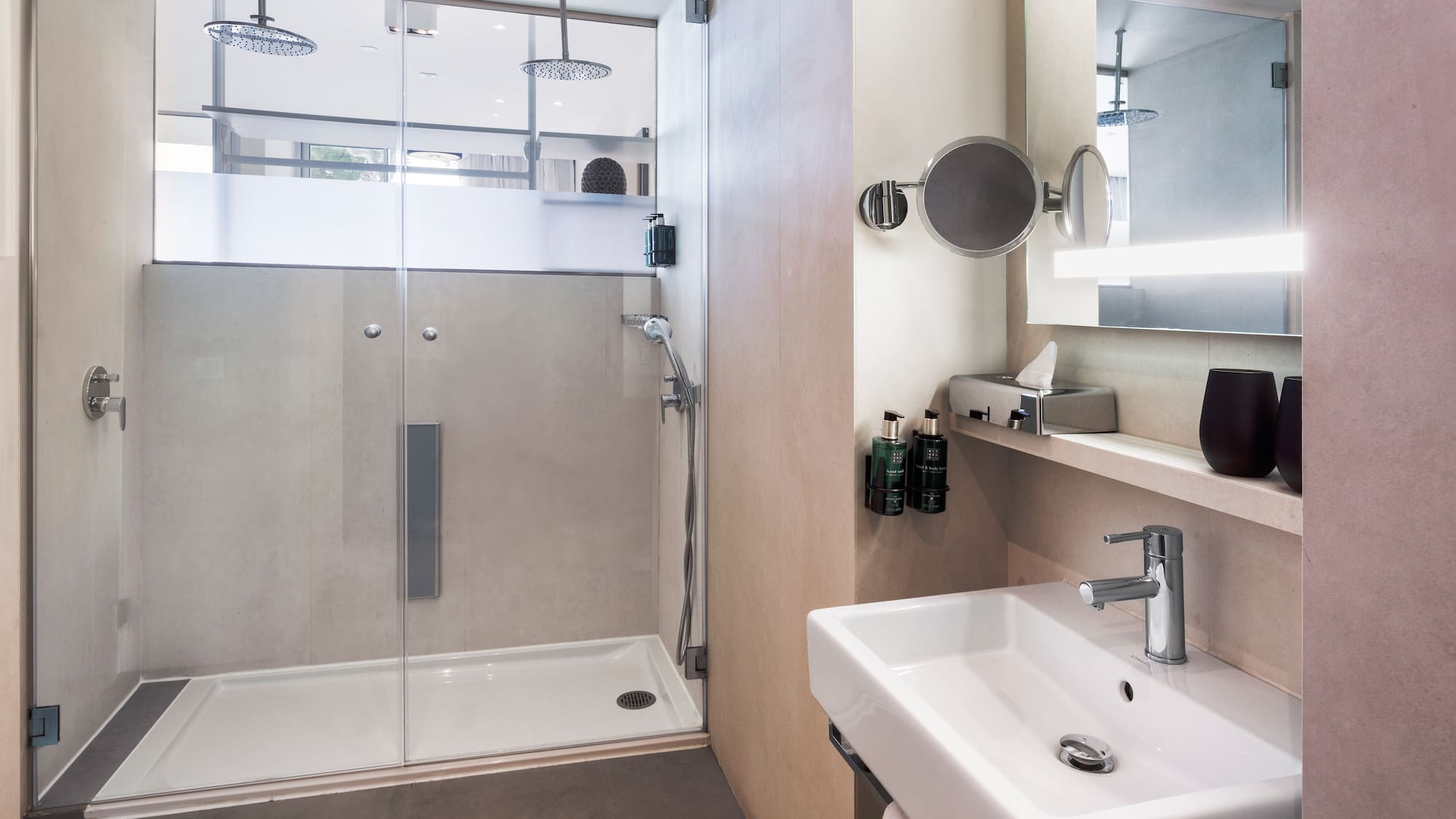 a bathroom with a shower and sink