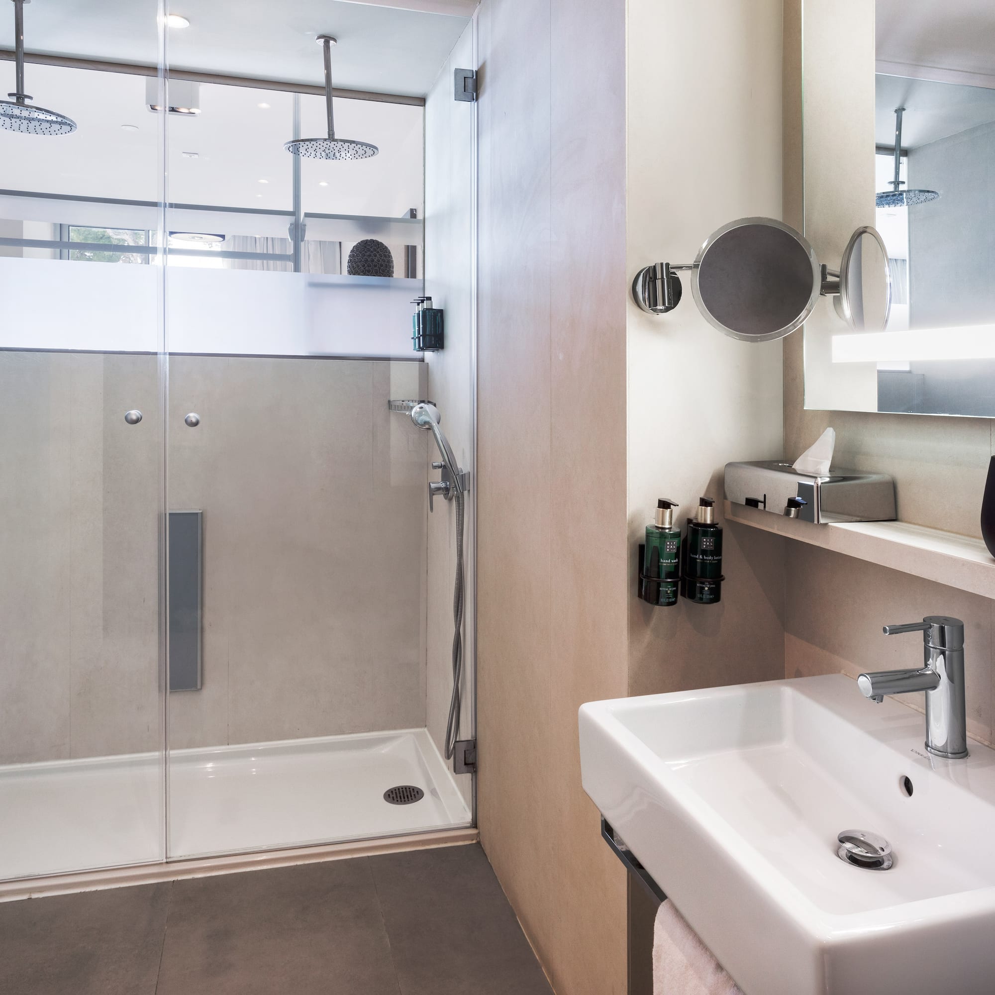 a bathroom with a shower and sink