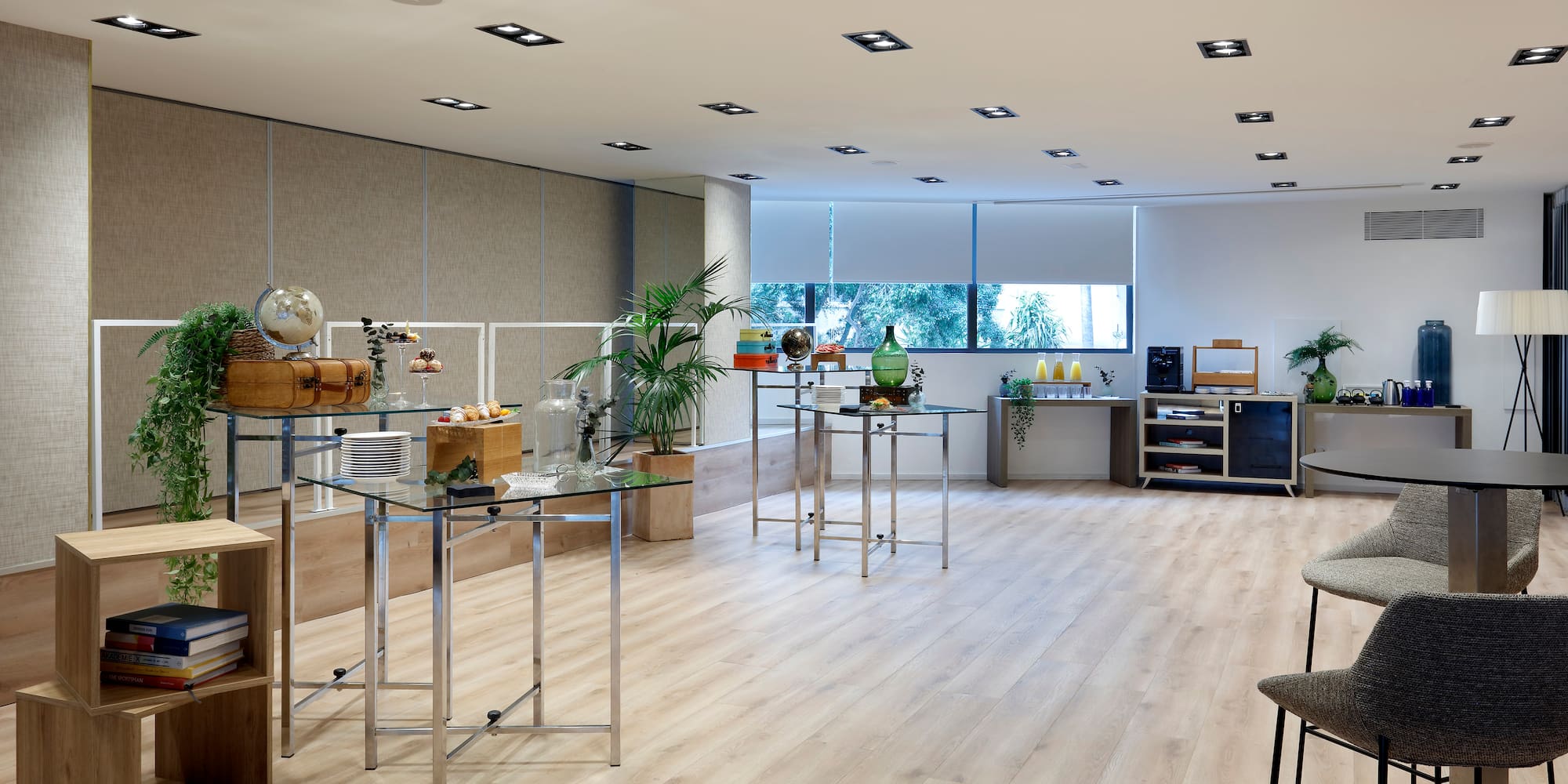 a room with a wood floor and a table with food items on it