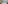 Modern event lounge with buffet tables, refreshments, and light wood floor.