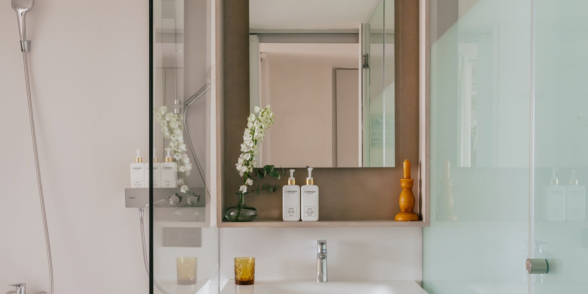 a bathroom with a mirror and sink