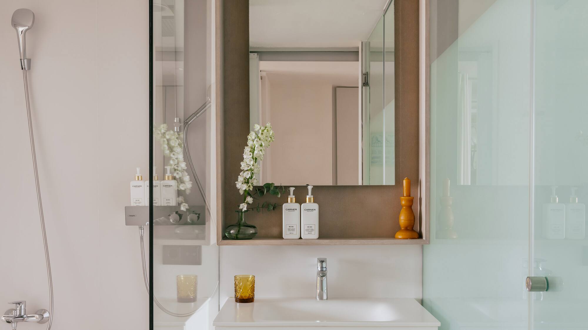 a bathroom with a mirror and sink