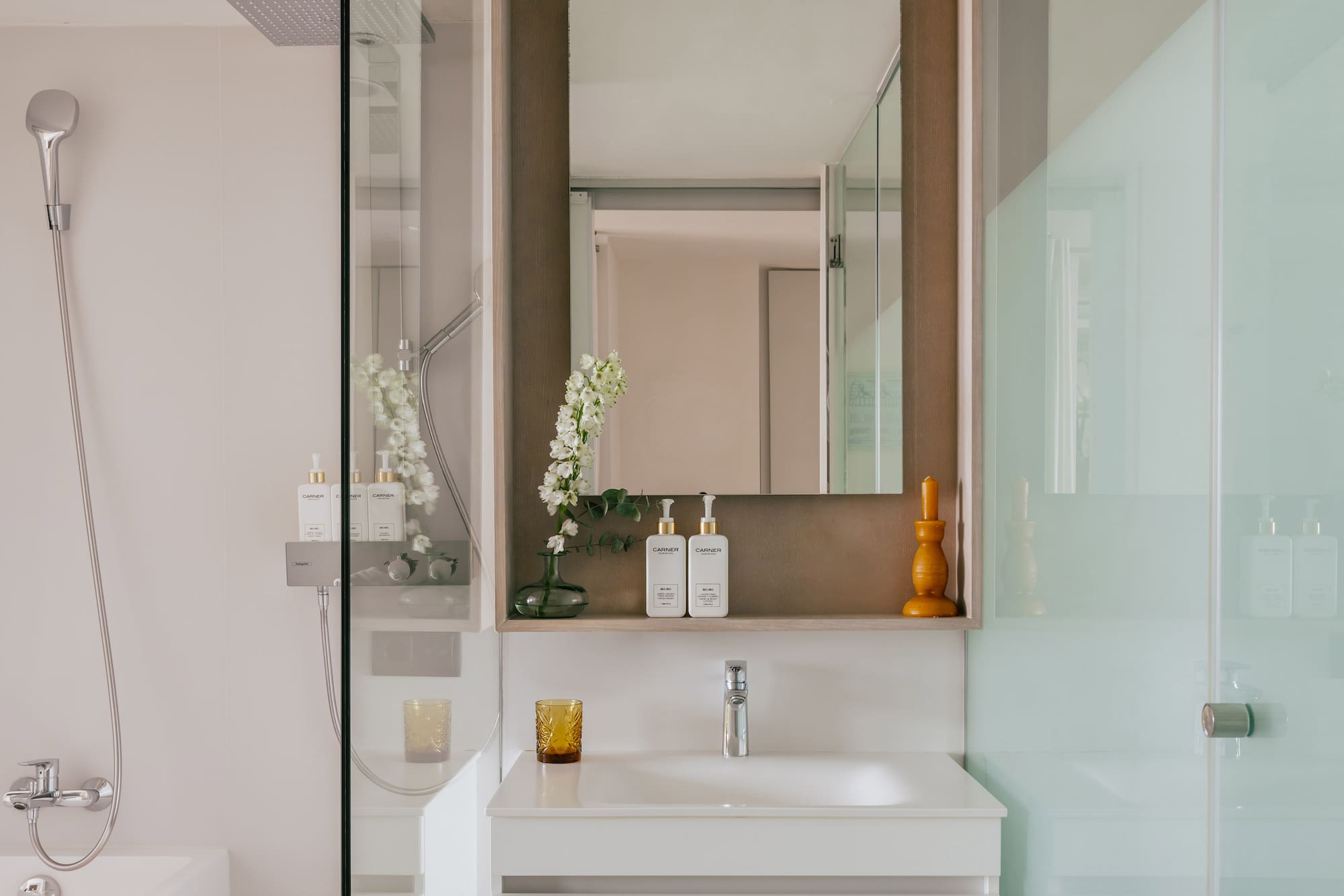 a bathroom with a mirror and sink