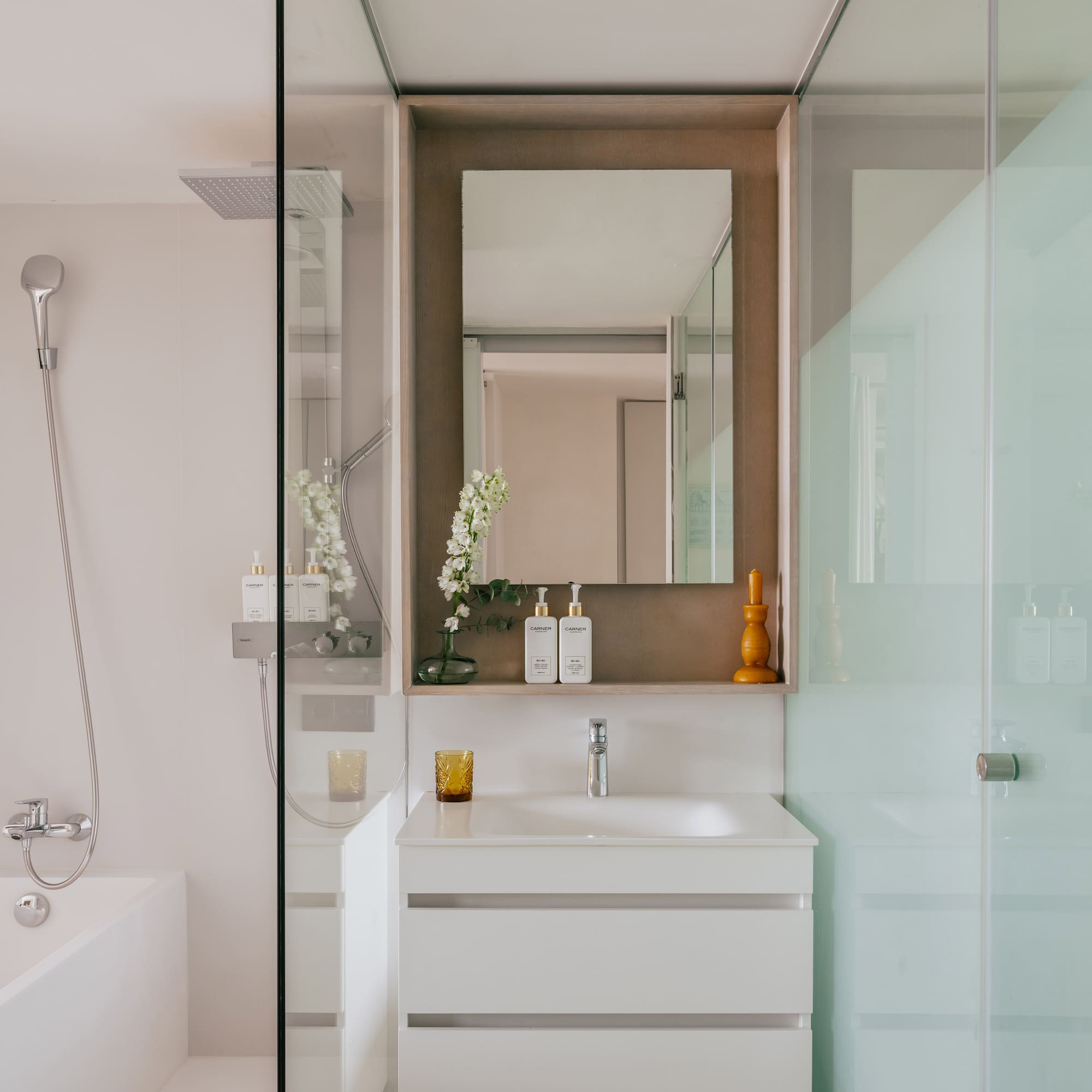 a bathroom with a mirror and sink