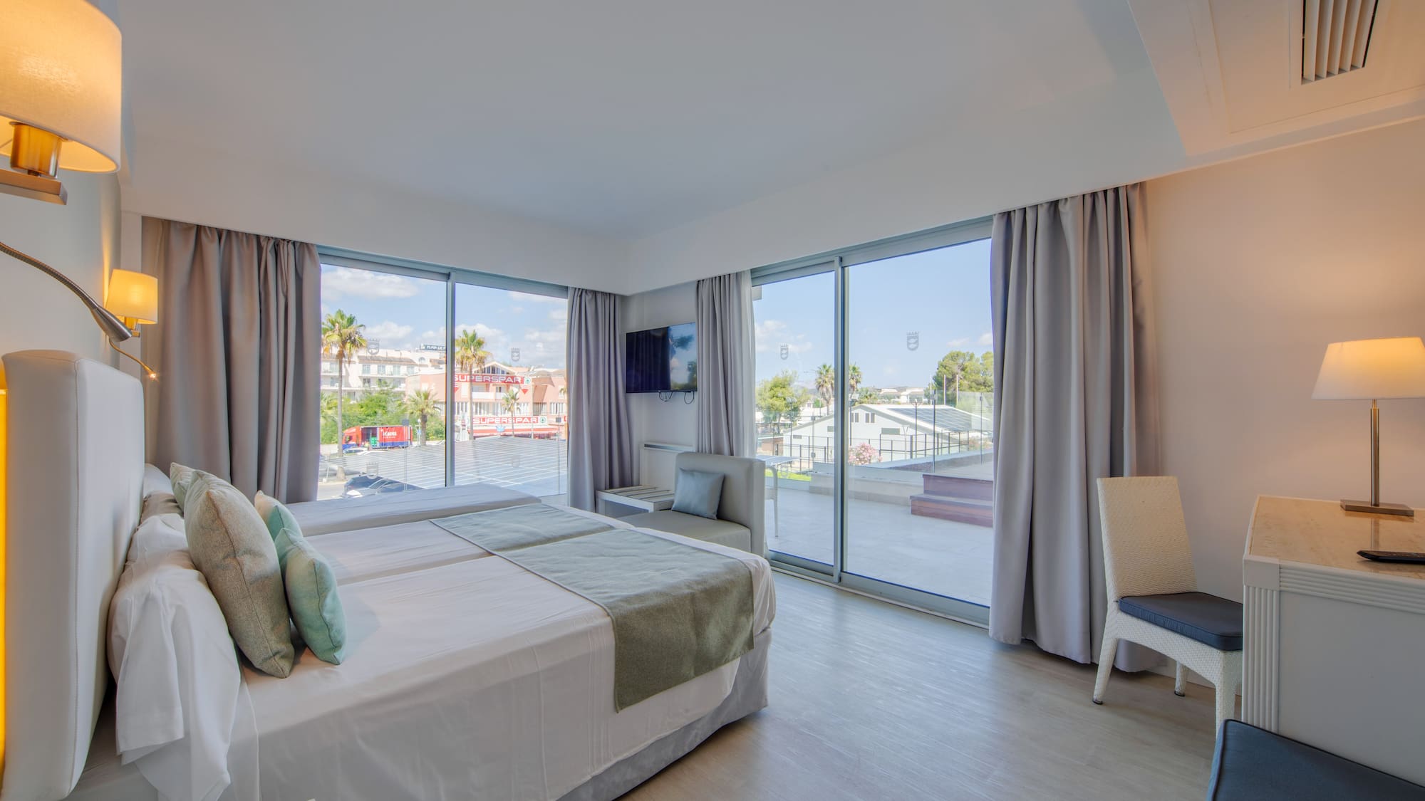 a bedroom with a large window