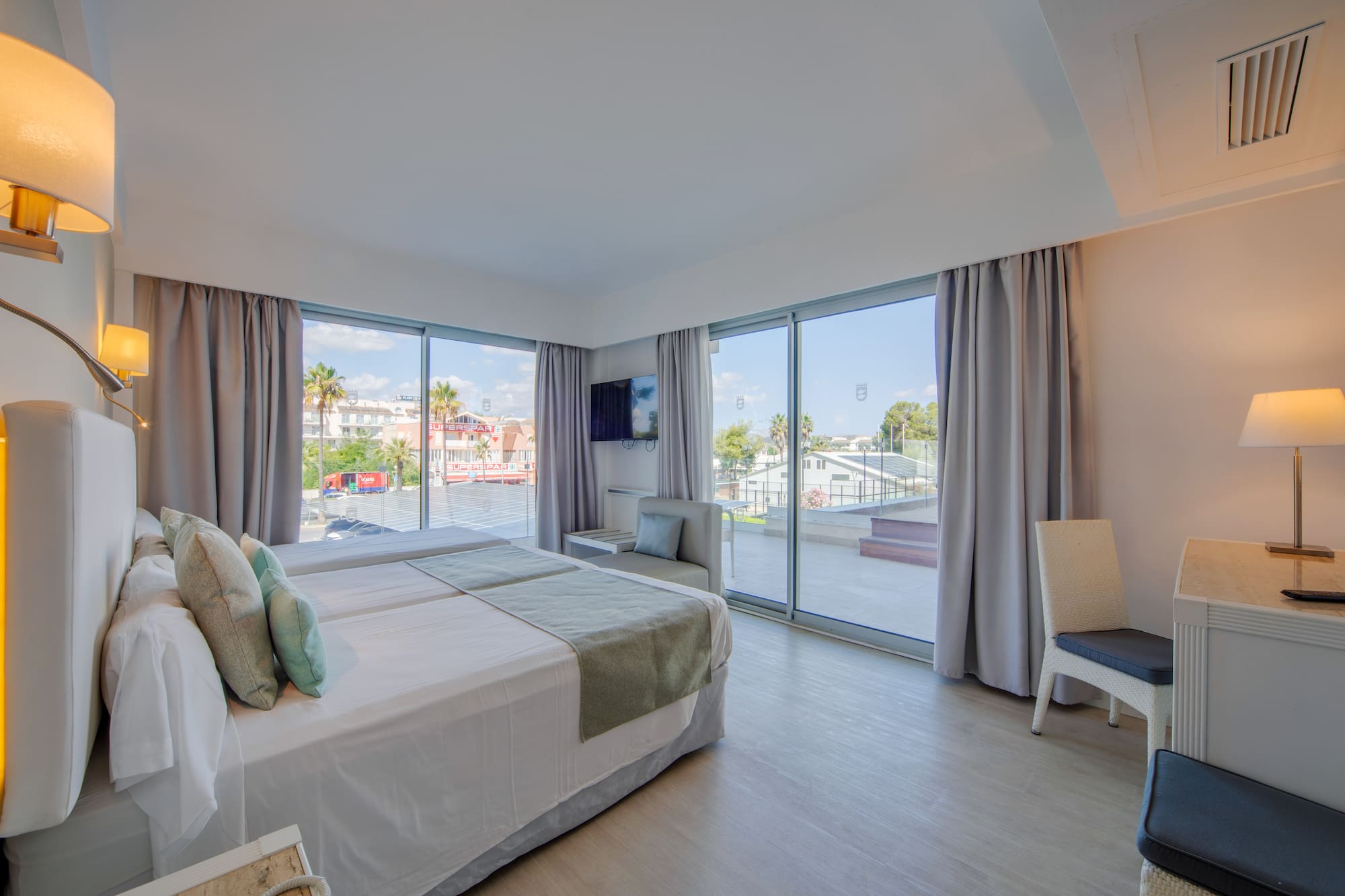 a bedroom with a large window