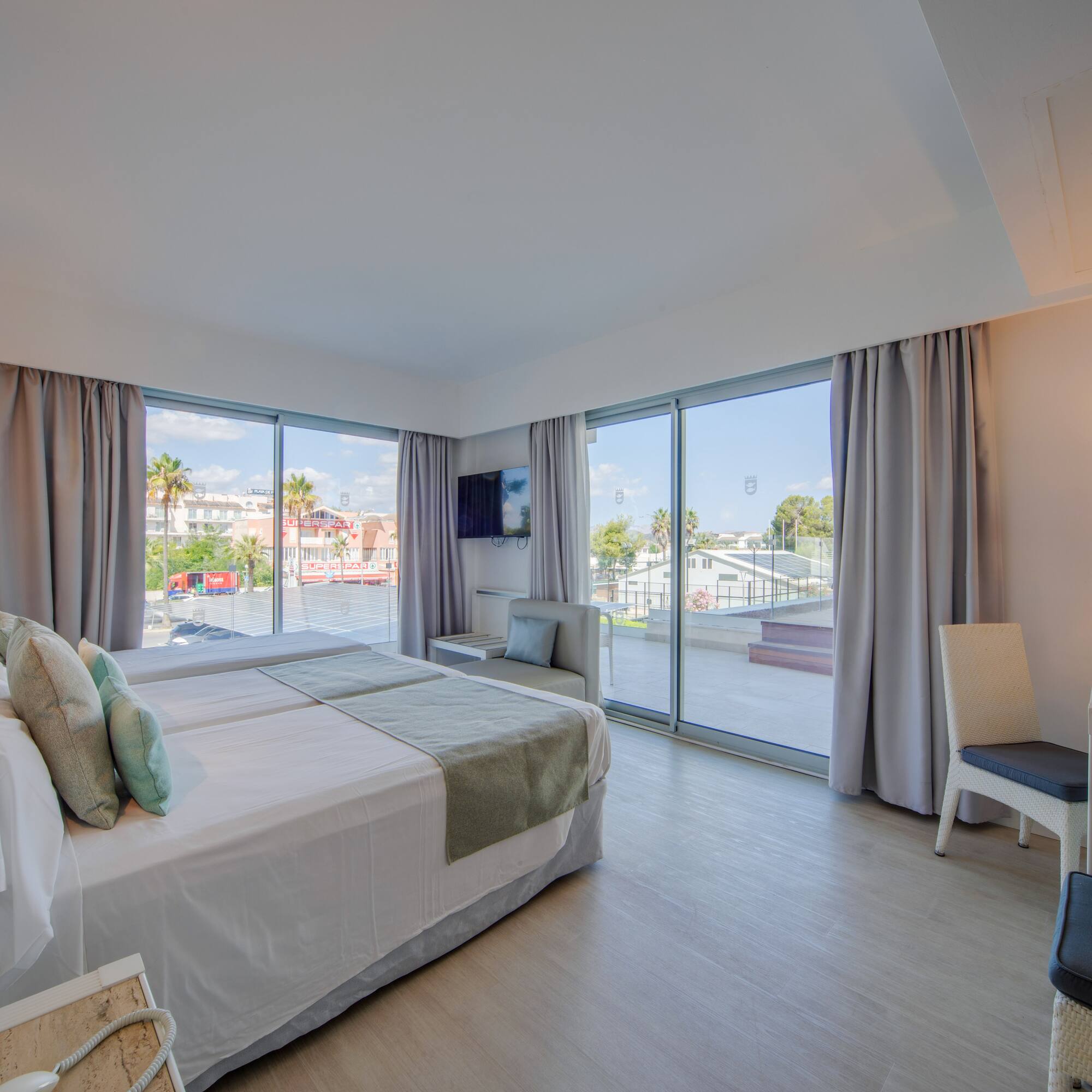 a bedroom with a large window