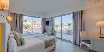 a bedroom with a large window