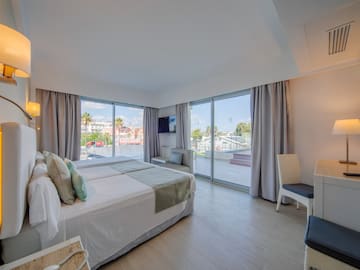 a bedroom with a large window