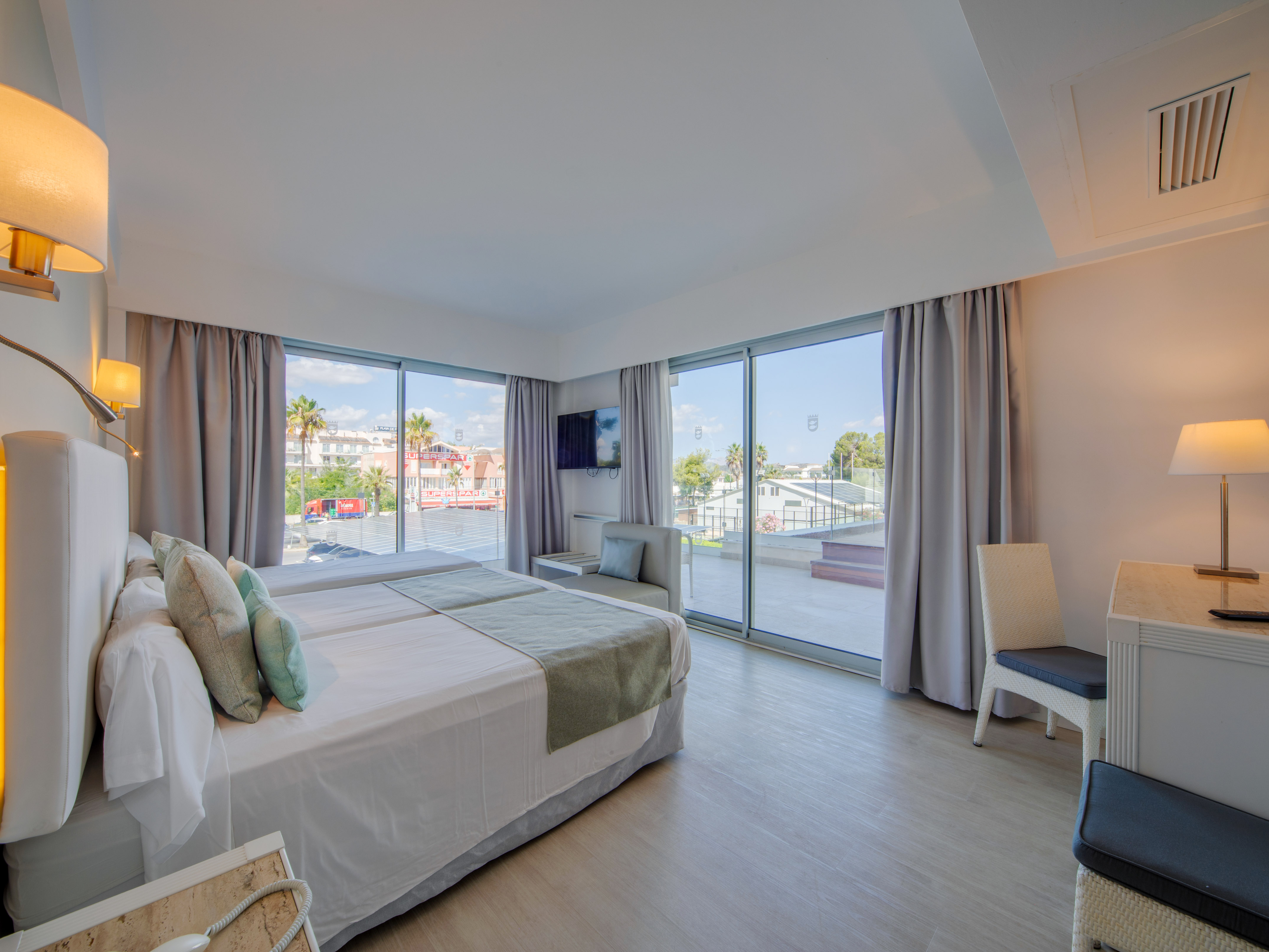 a bedroom with a large window