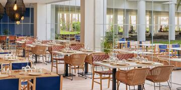 a restaurant with tables and chairs