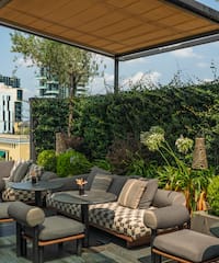 a patio with a table and chairs