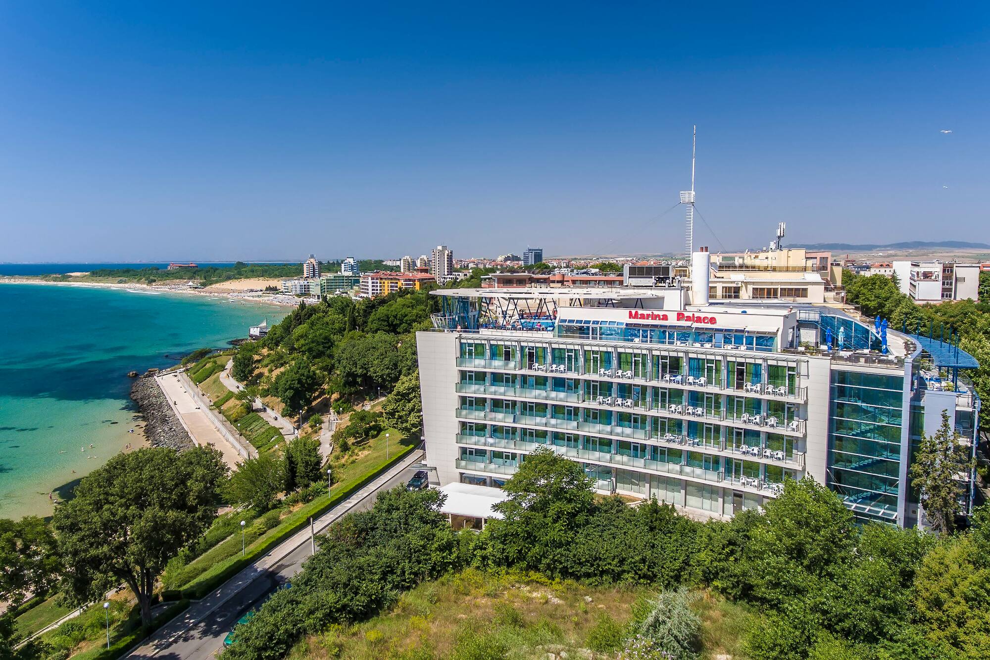 a building with many windows and a body of water