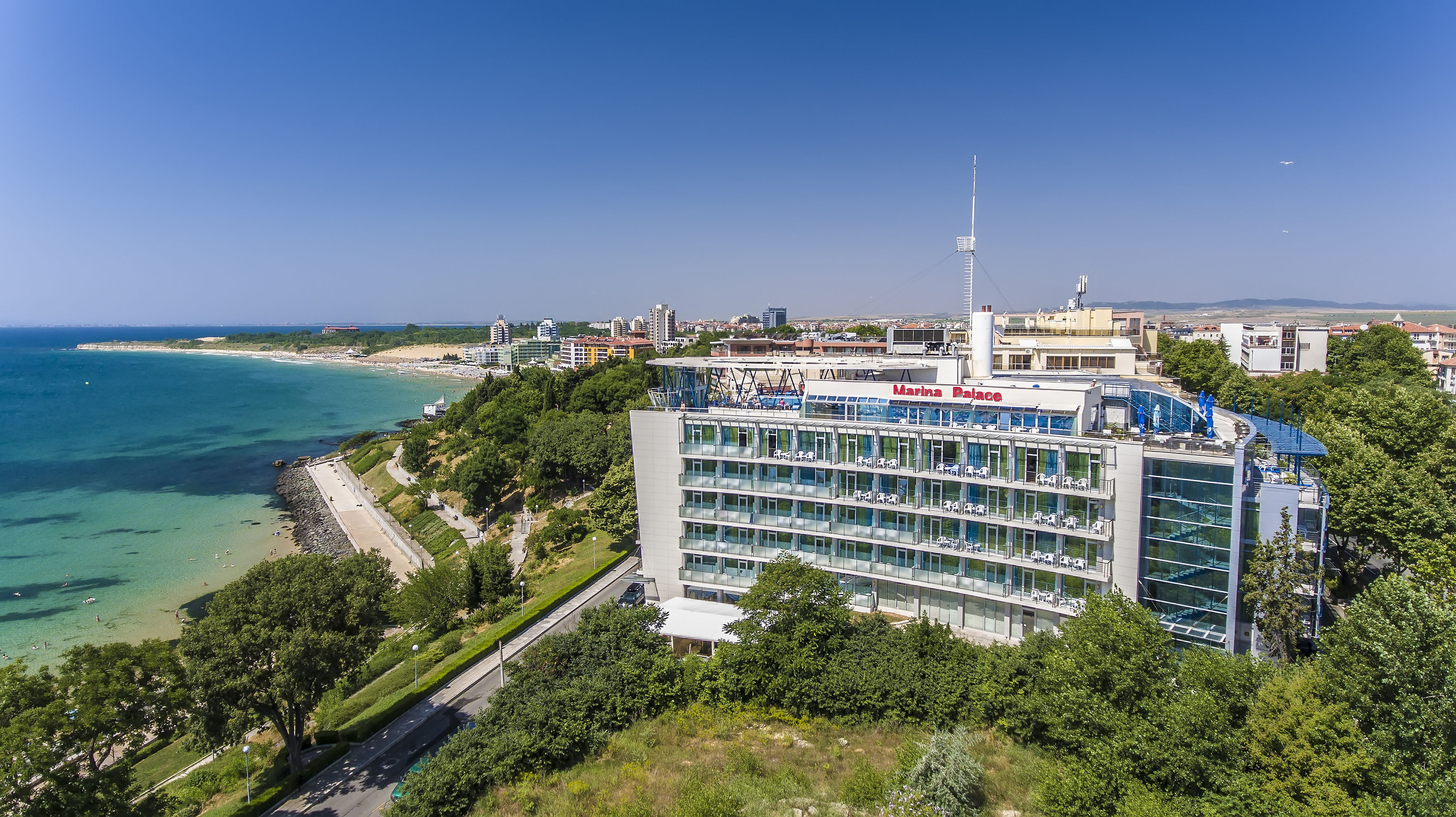 a building with many windows and a body of water