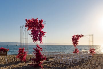 a wedding ceremony set up on a beach