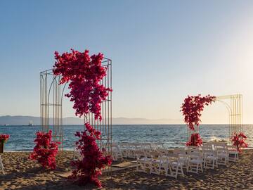 a wedding ceremony set up on a beach