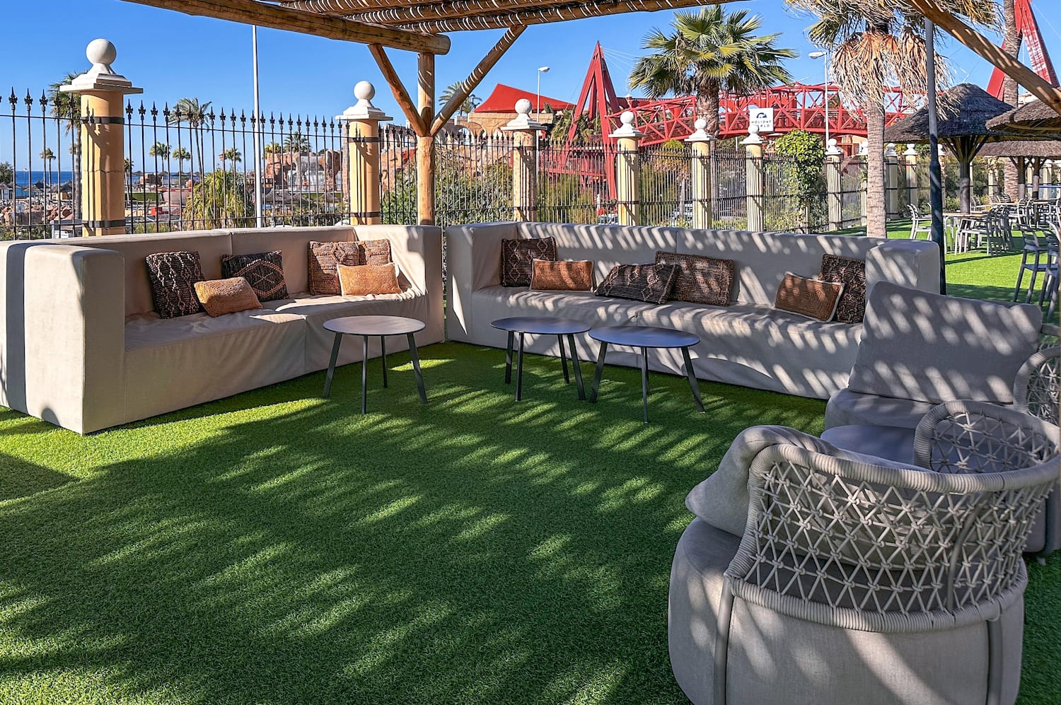 a patio with a couch and tables