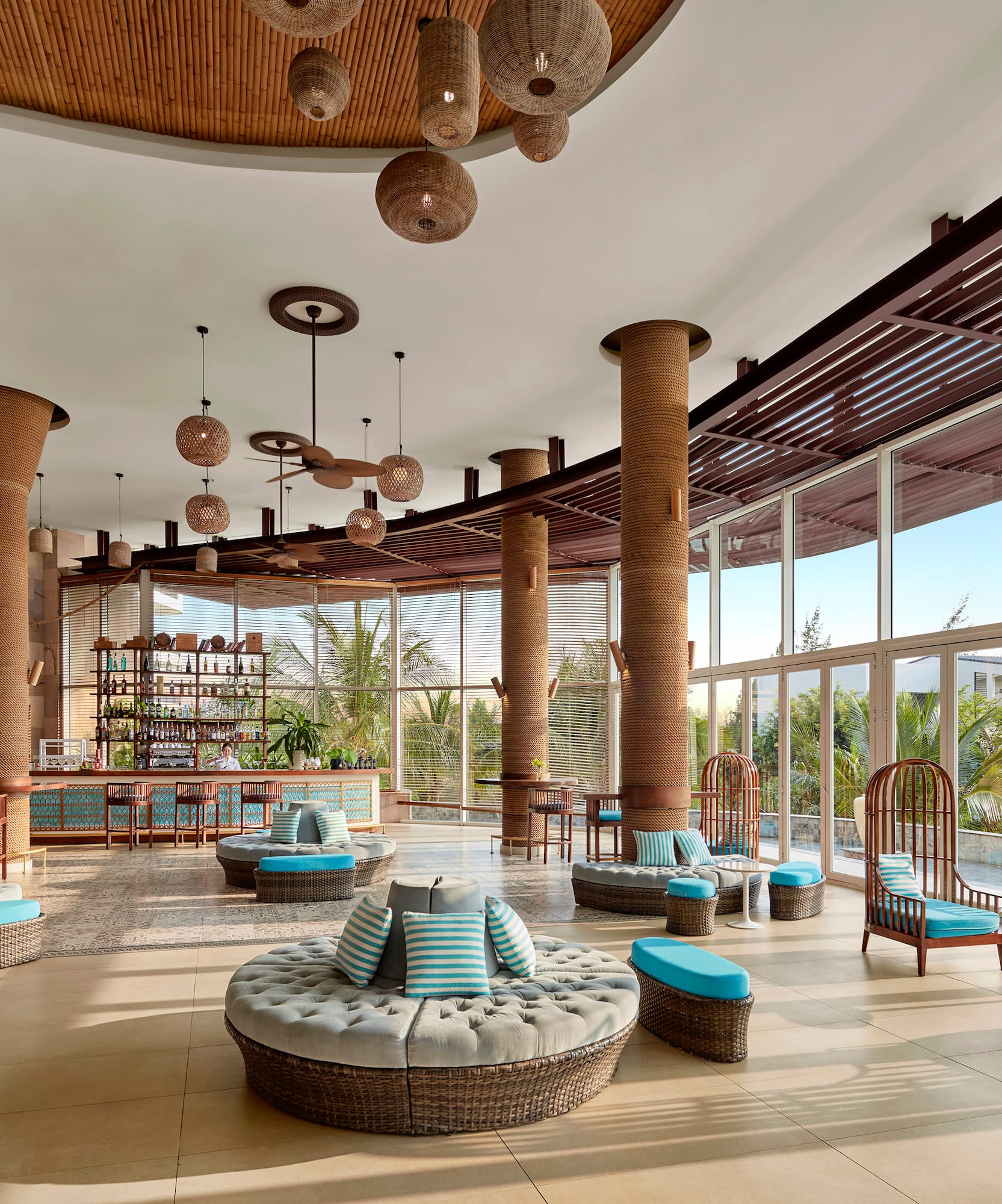 a large room with round seats and blue cushions