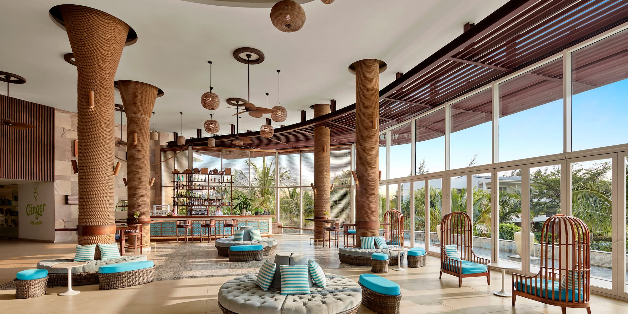 a large room with round seats and blue cushions