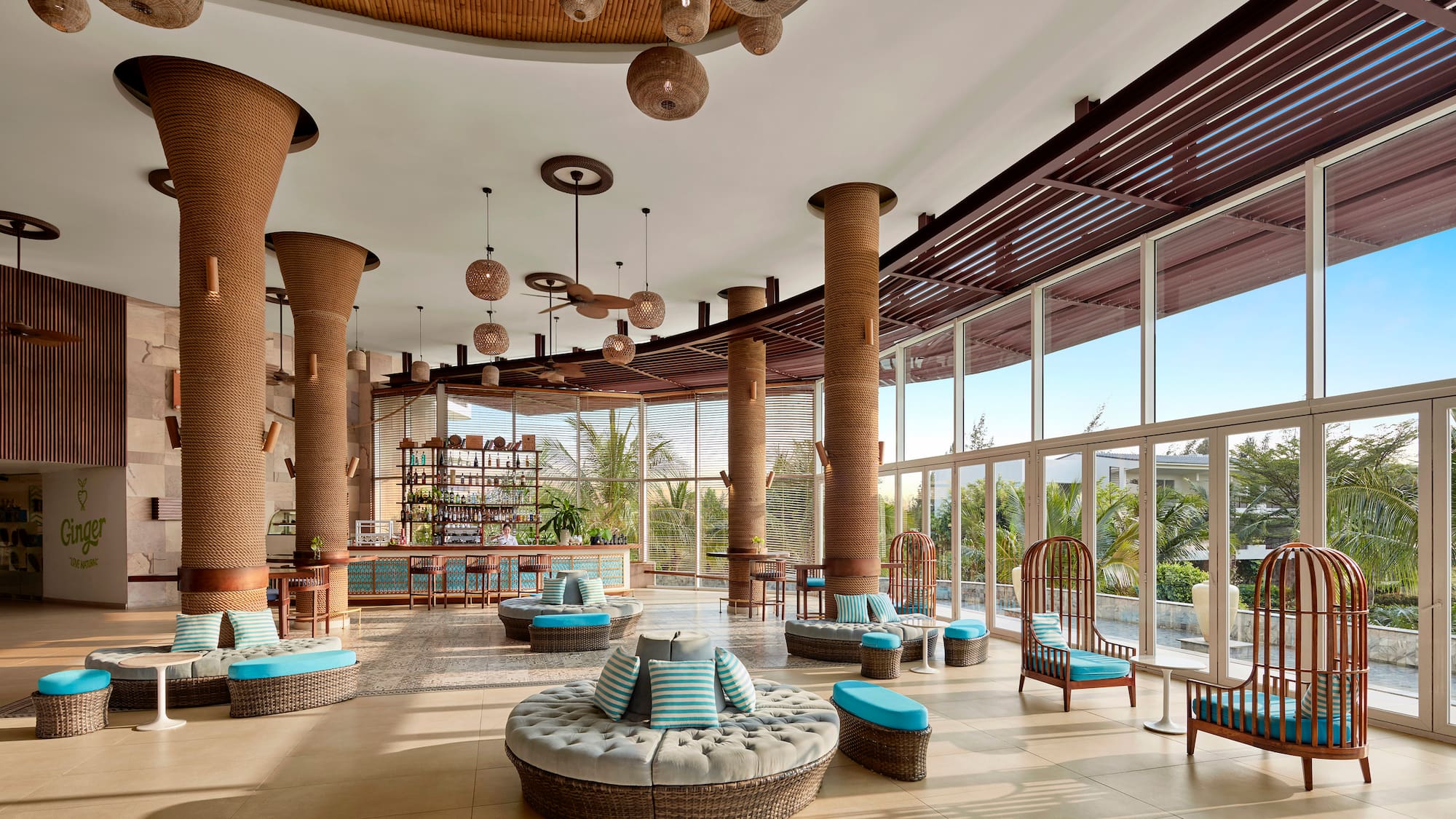 a large room with round seats and blue cushions