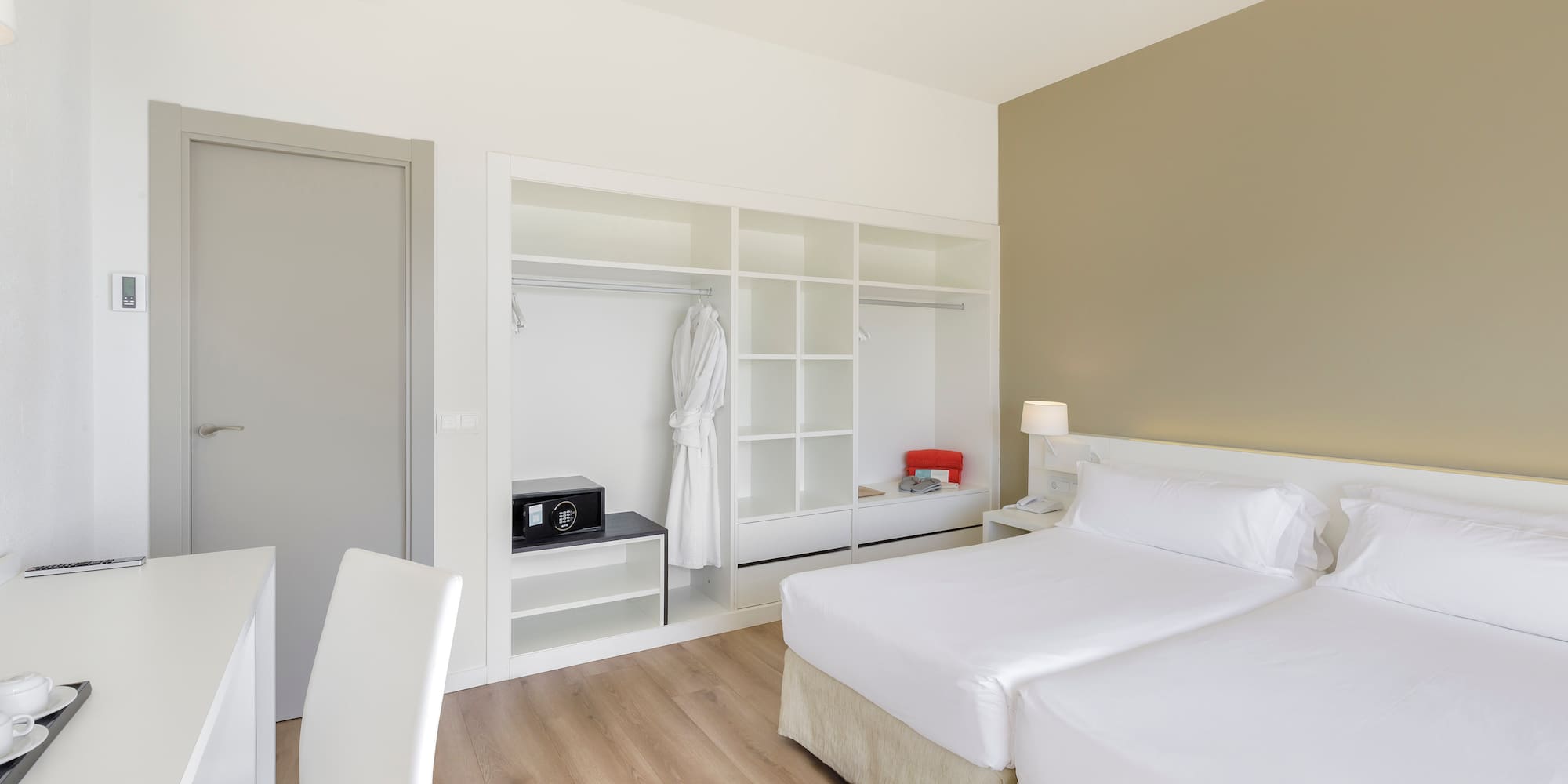 a room with two beds and a closet