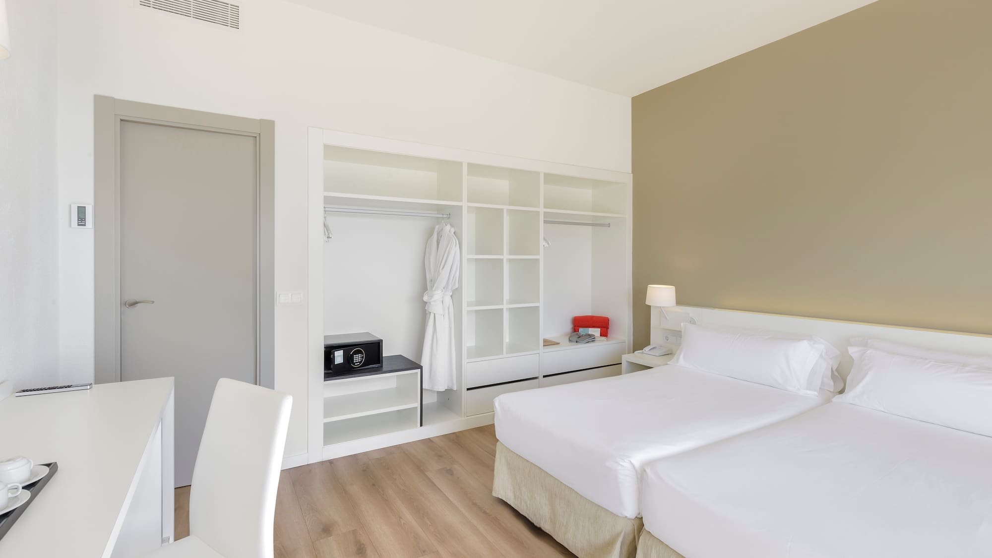 a room with two beds and a closet