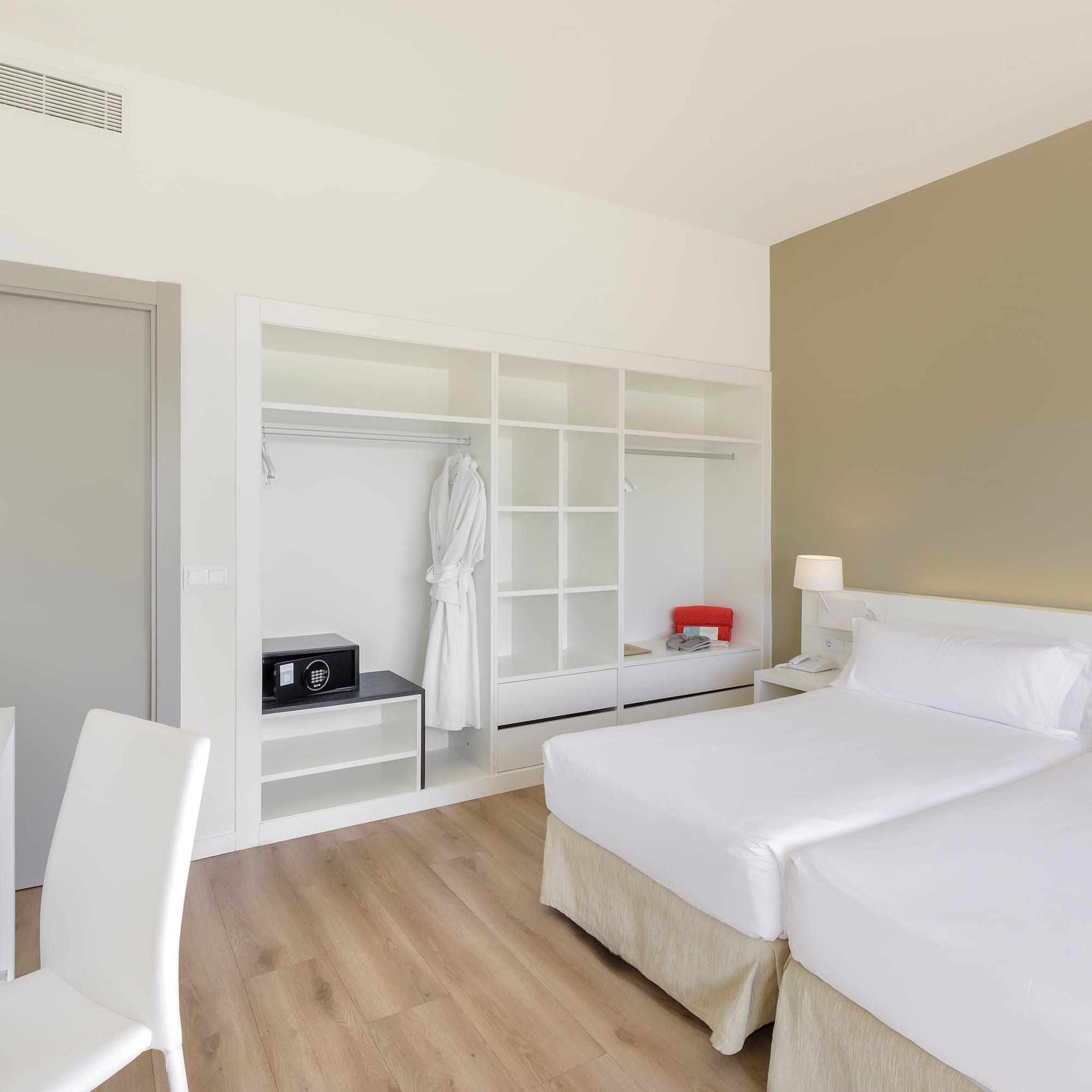 a room with two beds and a closet