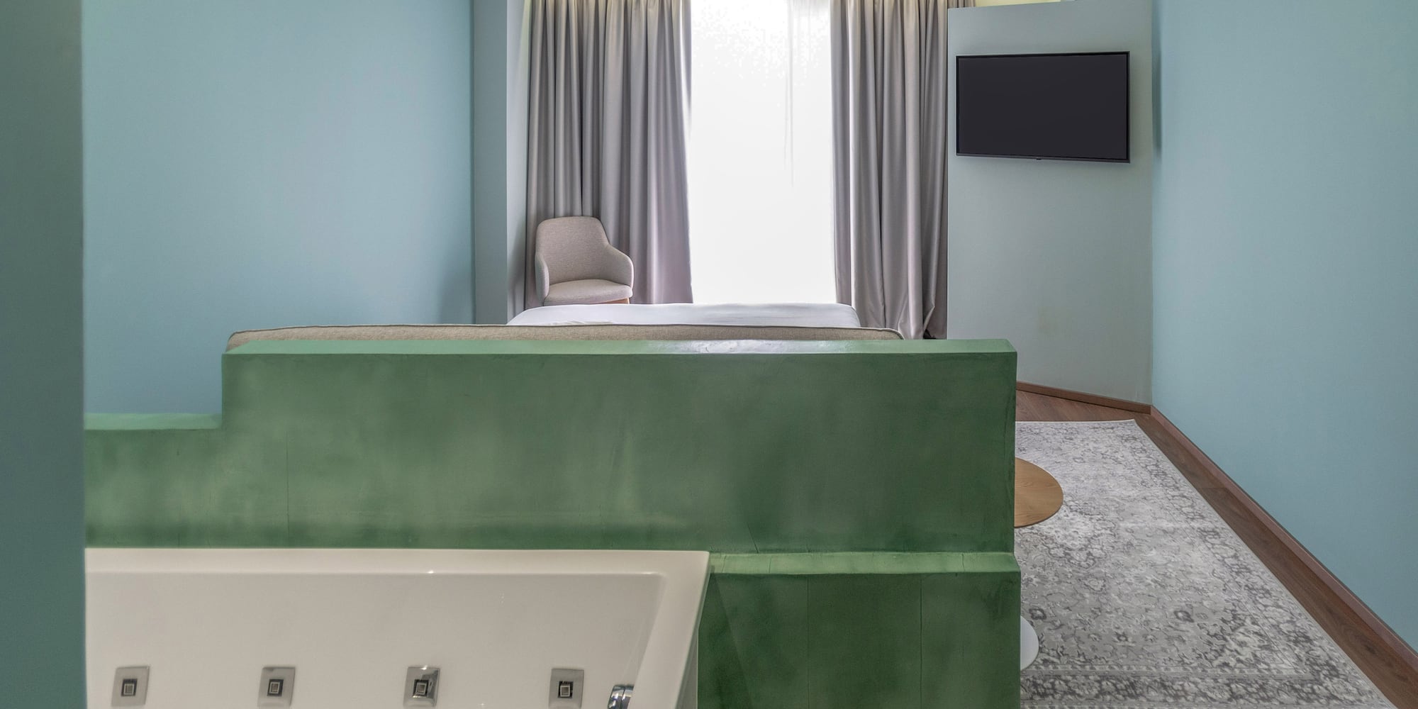 a room with a tv and a bathtub