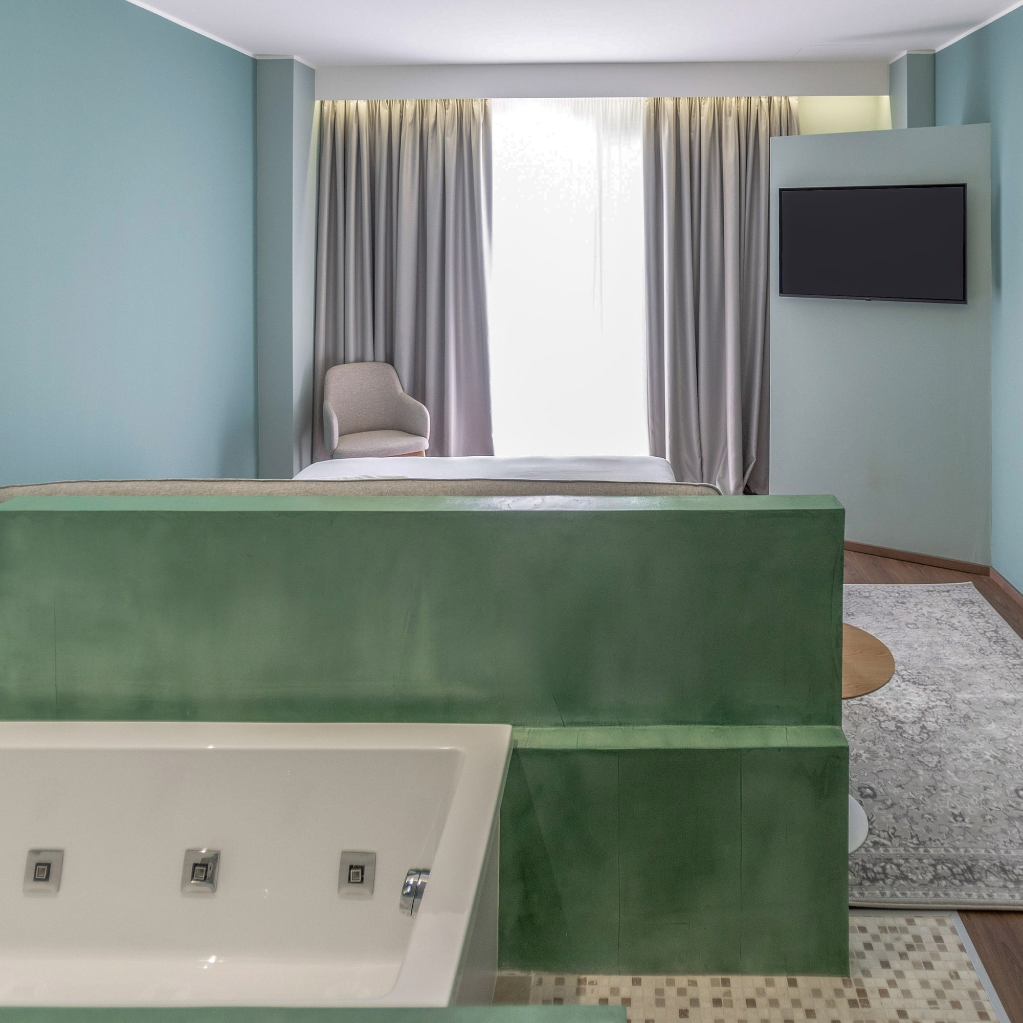 a room with a tv and a bathtub