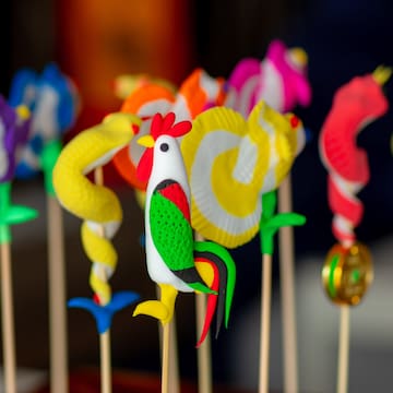 a group of colorful objects on sticks