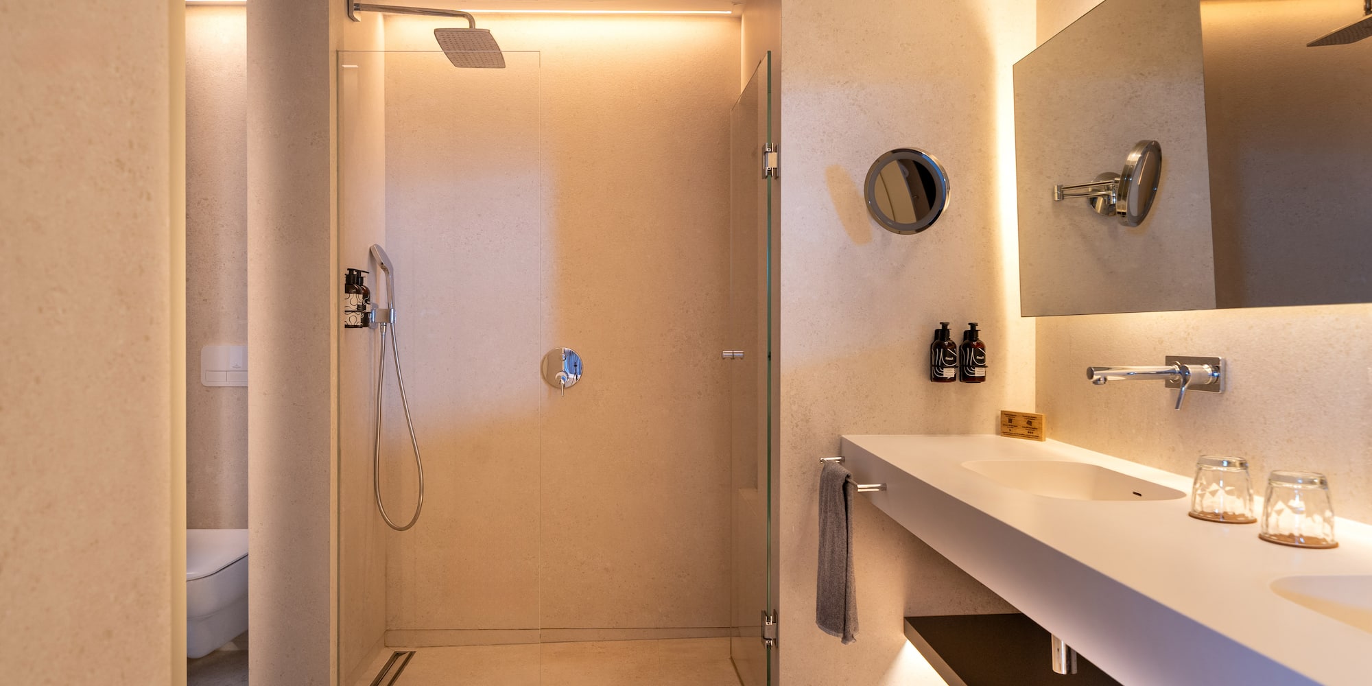 a bathroom with a shower and sink