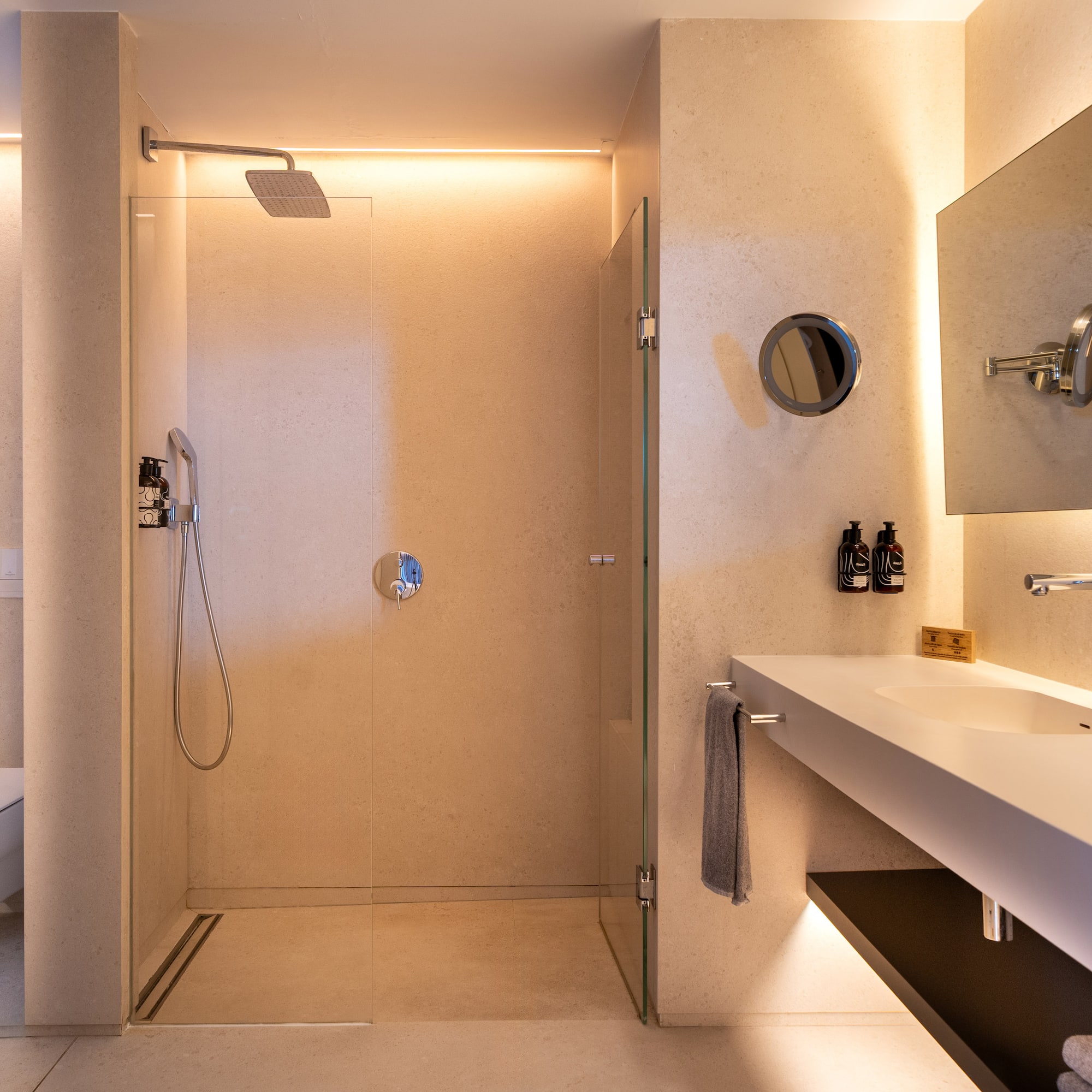 a bathroom with a shower and sink