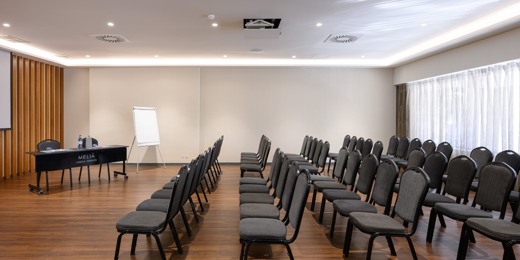 a room with chairs and a piano