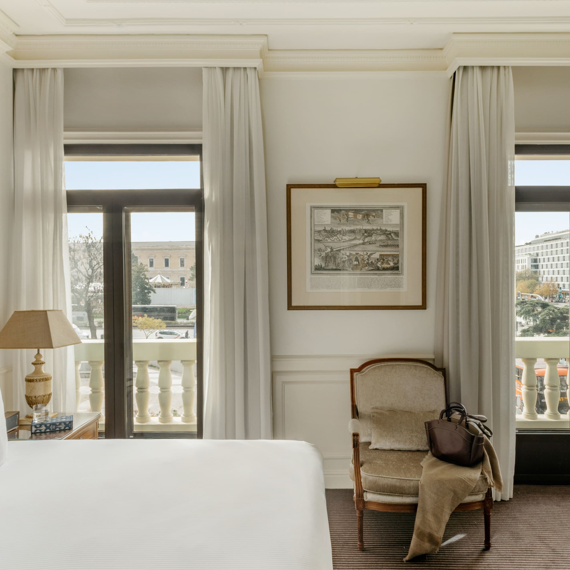 a bedroom with a bed and a chair