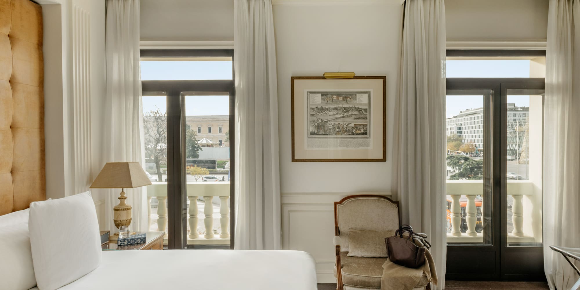 a bedroom with a bed and a chair