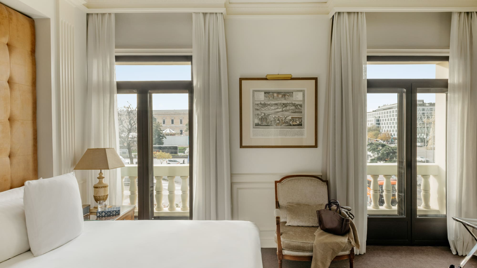 a bedroom with a bed and a chair